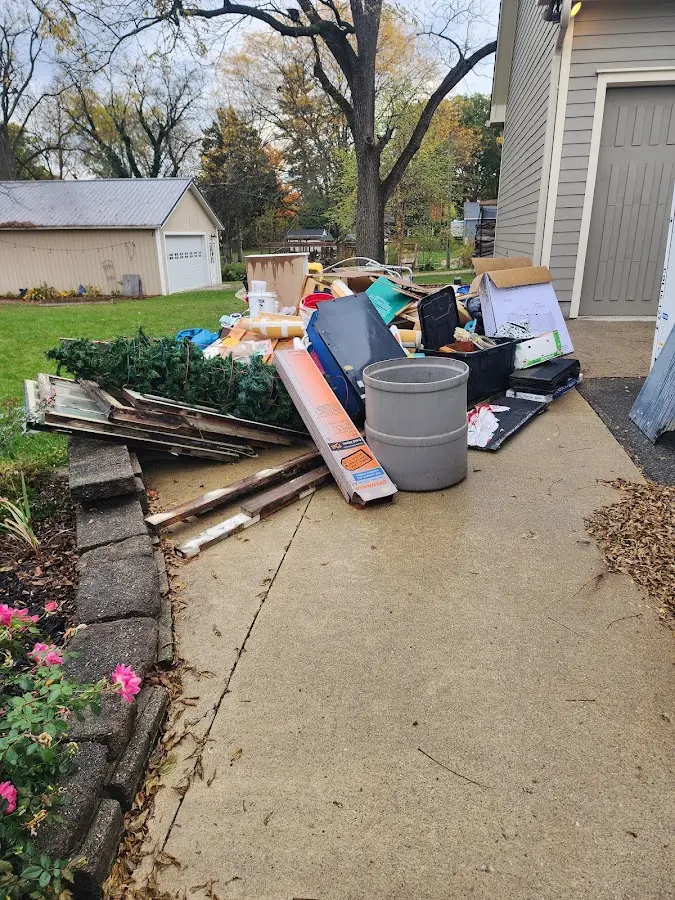 Dumpster being loaded with debris for 30 Yard Dumpster Rental in Douglasville